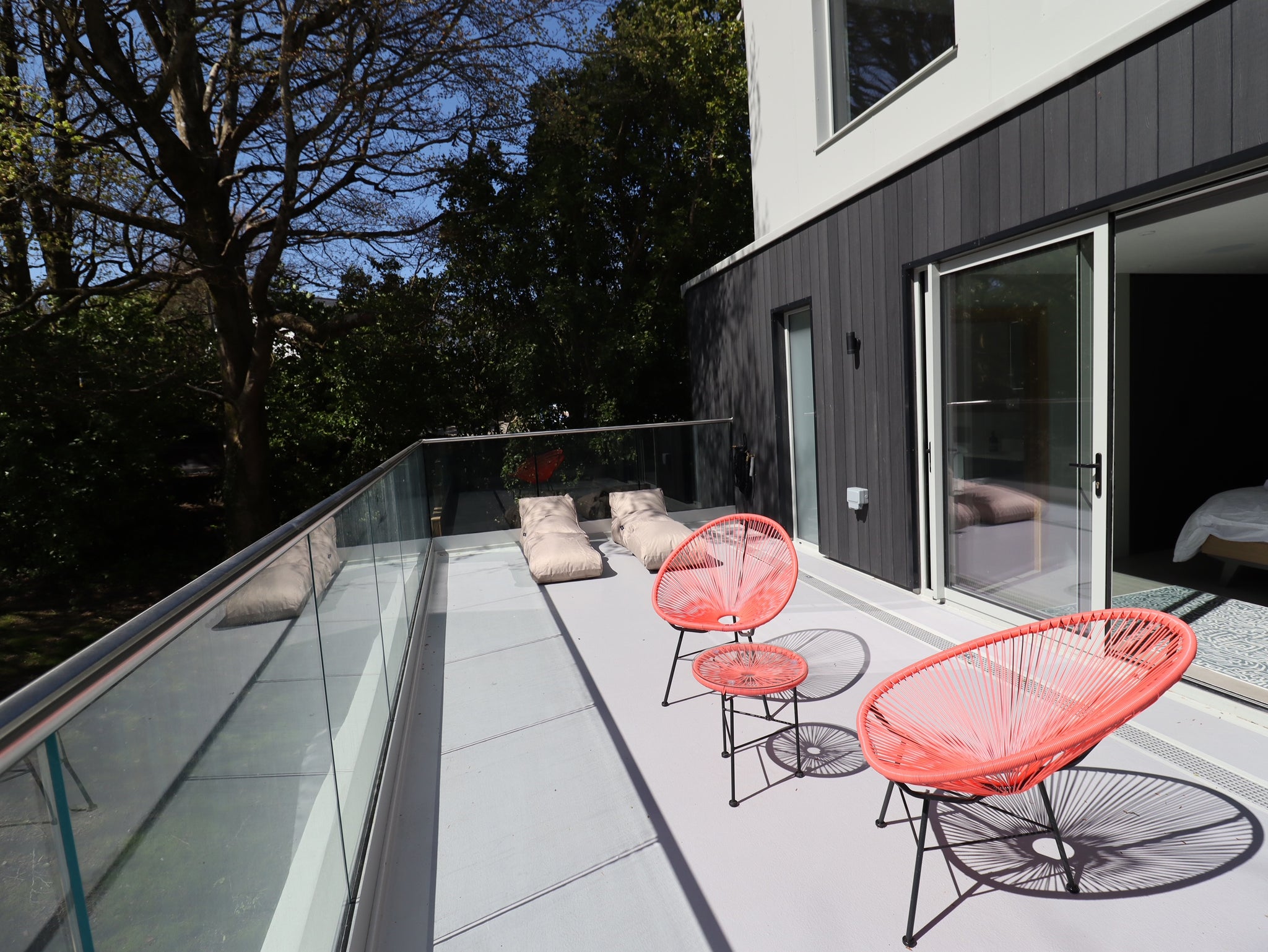 Balcony of house with finished off with  Deckz Composites Vintage Charred Cedar Cladding